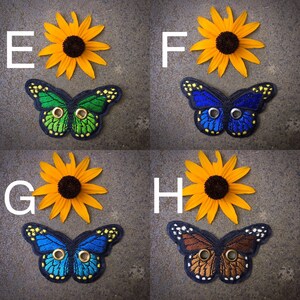Peut inclure: Quatre ensembles de patchs brod&eacute;s de papillons et de tournesols. Chaque ensemble pr&eacute;sente un papillon de couleur diff&eacute;rente avec un bouton dor&eacute;. Les papillons sont verts, bleus, bruns et bleus. Les tournesols sont jaunes avec des centres bruns.