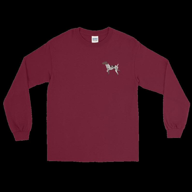 May include: A maroon long-sleeve t-shirt with a small embroidered image of a black and white dog on the left chest.