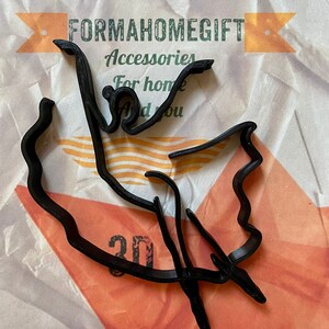 May include: Black 3D printed outline of the state of Mexico. The outline is on a white and orange textured background. The text "FORMAHOMEGIFT Accessories For home And you" is visible in the background.