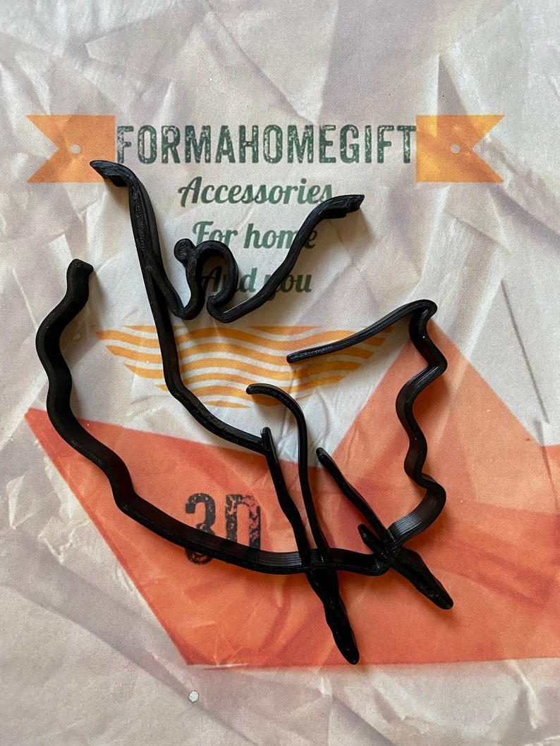 May include: Black 3D printed outline of the state of Mexico. The outline is on a white and orange textured background. The text "FORMAHOMEGIFT Accessories For home And you" is visible in the background.