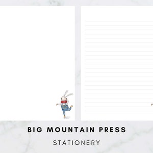 May include: A white bunny wearing a red scarf and blue overalls is on a white sheet of paper with lined paper on the right side. The paper has the text "BIG MOUNTAIN PRESS STATIONERY" at the bottom.