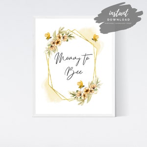 May include: A printable digital download with a gold geometric frame and watercolor flowers. The text "Mommy to Bee" is written in black cursive script. The design features yellow and black bees.