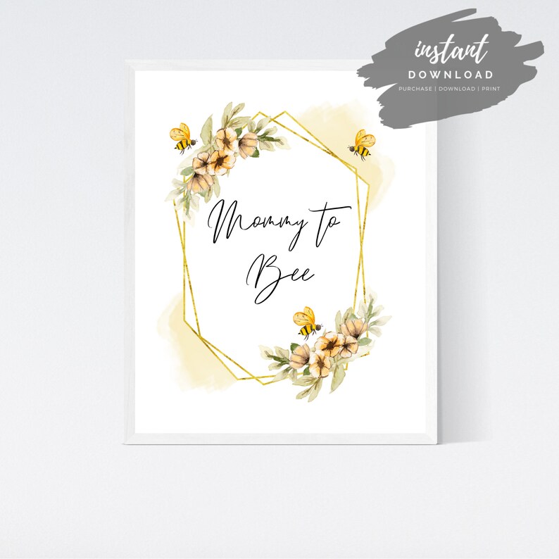 May include: A printable digital download with a gold geometric frame and watercolor flowers. The text "Mommy to Bee" is written in black cursive script. The design features yellow and black bees.