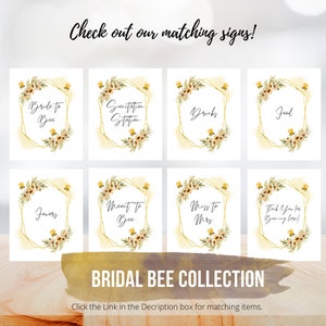 May include: Eight printable signs with a gold hexagonal frame and watercolor floral design. The signs say "Bride to Bee", "Sanitation Station", "Drinks", "Food", "Favors", "Meant to Bee", "Miss to Mrs", and "Thank You for Beeing Here!" The signs are part of a bridal bee collection.