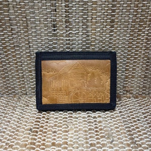 Escena de cabina de cuero vintage y cartera de tela negra/carteras de cuero vintage