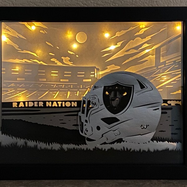 Raiders helmet inspired lighted shadow box
