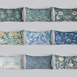 May include: Nine rectangular cushions with floral patterns in shades of blue, green, yellow, and brown. The cushions feature botanical designs, including flowers, leaves, and abstract swirls. The cushions are arranged in a three-by-three grid.