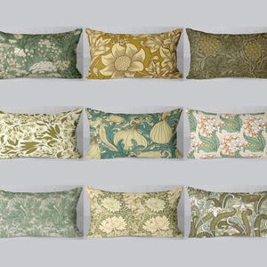 May include: Nine rectangular cushions featuring floral patterns in green, yellow, and cream. The designs showcase botanical illustrations of flowers, leaves, and other natural elements. The cushions are displayed against a light grey backdrop.