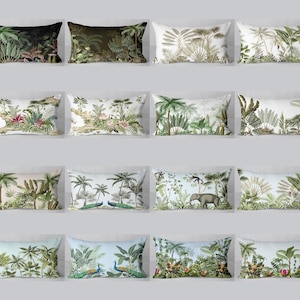 May include: A collection of rectangular throw pillows featuring various tropical and jungle-themed designs. The pillows showcase lush greenery, including palm trees, ferns, and other exotic plants, with some designs incorporating animals like peacocks and elephants. The color palette includes shades of green, brown, and white.