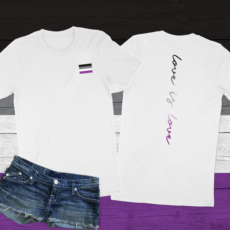 May include: White t-shirt with a black, white, and purple flag on the left chest and the text "love is love" in purple and black on the back.