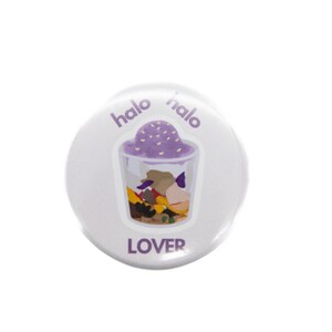 May include: A white button with the text "halo halo lover" and a cartoon illustration of a halo halo dessert.