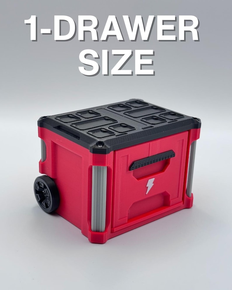 May include: A red and black storage container with a lightning bolt graphic and the text "1-DRAWER SIZE". The container has a black top with compartments, a handle, and a wheel on one side. The container has silver accents.