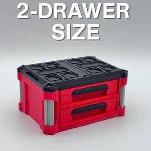 May include: A red 2-drawer storage container with a black top and grey accents. The text "2-DRAWER SIZE" is displayed above the container. The container has two drawers with black handles.