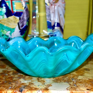 Vintage fussed glass dish in the shape of a shell with dancing blue turquoise lines