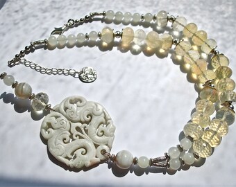 Designer necklace from rare large faceted milky quartz, jade, silver plated beads and spectacular hand carved jade pendant