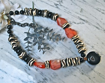Ethnic necklace made from onyx, fire agate, African bone beads and large agate pendant