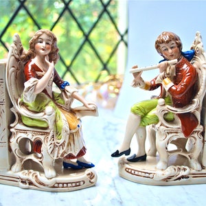 Continental porcelain pair of beautiful figurines as bookends, vintage and in excellent condition