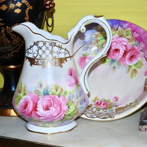Stunning large jug and a bowl hand painted with roses made in the Netherlands in the 20th century