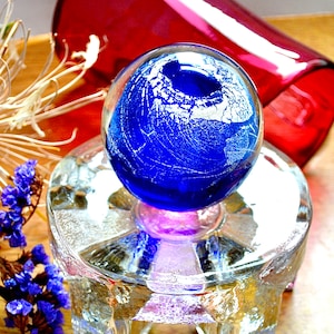 Vintage dome paperweight in delightful rich ultramarine colour with mesmerising silver texture in floating movement, signed