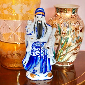 Vintage porcelain large figurine of a dignitary hand painted in blue and gold, probably Chinese