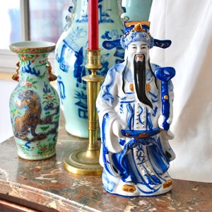 Large vintage porcelain figurine of an oriental dignitary hand painted in blue and gold