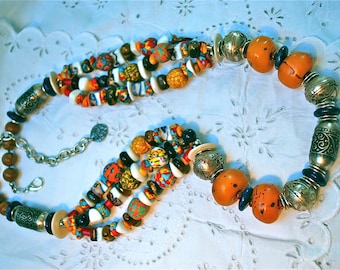 Statement necklace with large copal beads, gemstones and hand etched Moroccan and Ehtiopian metal beads