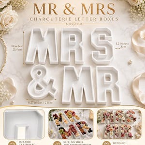 May include: White "MR & MRS" charcuterie letter boxes, 10 inches (25.4 cm) tall, 8.27 inches (21 cm) wide, and 1.2 inches (3 cm) deep. The boxes are designed for wedding party favors and centerpieces. The text "ELEGANT. TIMELESS. UNFORGETTABLE." is at the top.