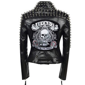 May include: Black faux leather biker jacket with silver spikes on the shoulders and collar. The back has a patch with a skull, motorcycle, and the text "Lucky 7 Bikes Road Brigade U.S.A. Live to Ride."