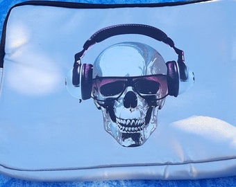 Groovy Skull laptop bag, great condition.  Silver vynil with a skull wearing headphones on the front.