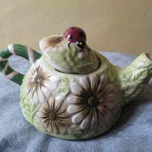 Teapot for one, garden flowers with a lady bird top.  vintage teapot\teapot\ceramic teapot\ladybird teapot