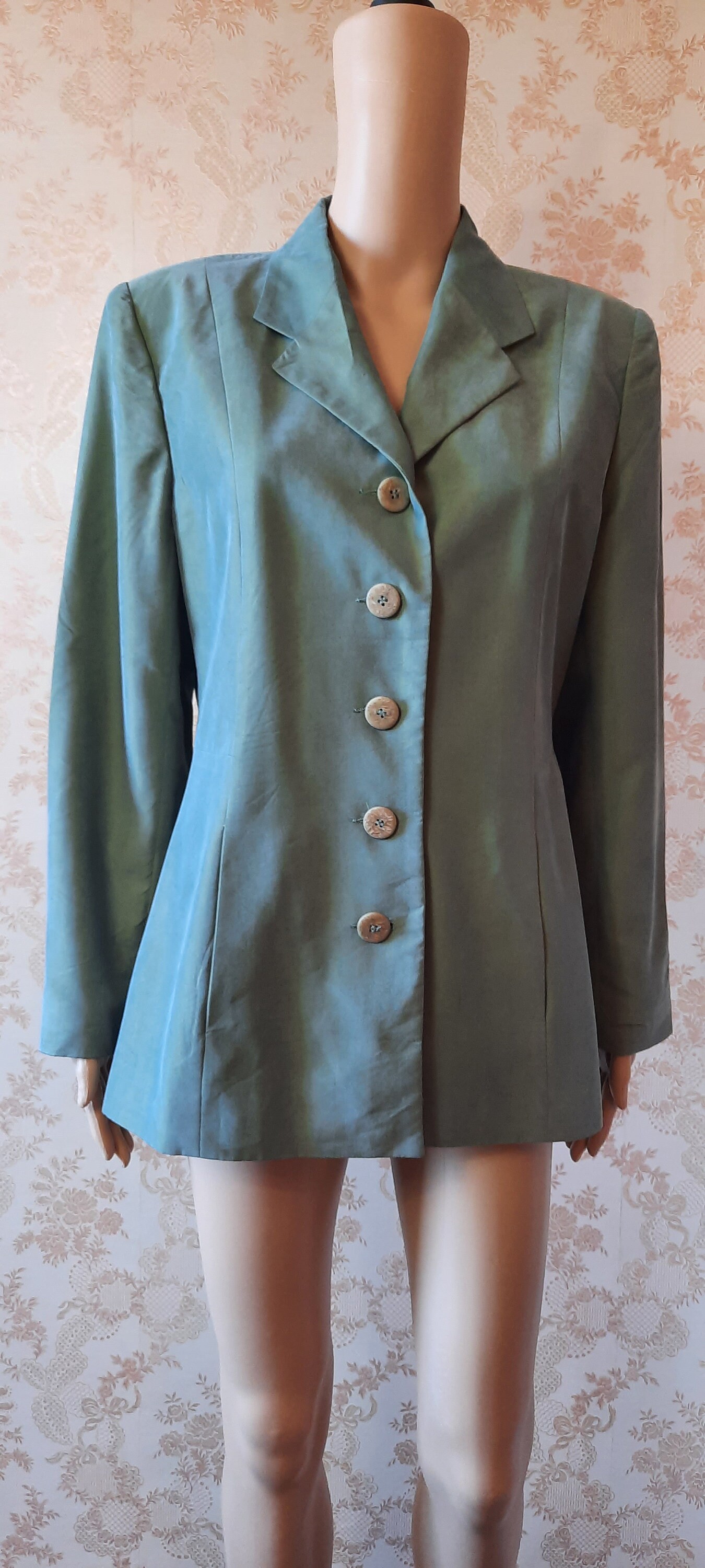 Veste vintage vert clair scintillant. veste vintage este verte este intelligente este formelle este d'été