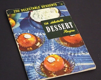 May include: Vintage cookbook titled "250 Delectable Desserts" with a retro design. The cover features images of desserts on plates, including a dish of whipped cream. The book has a blue and white striped background.
