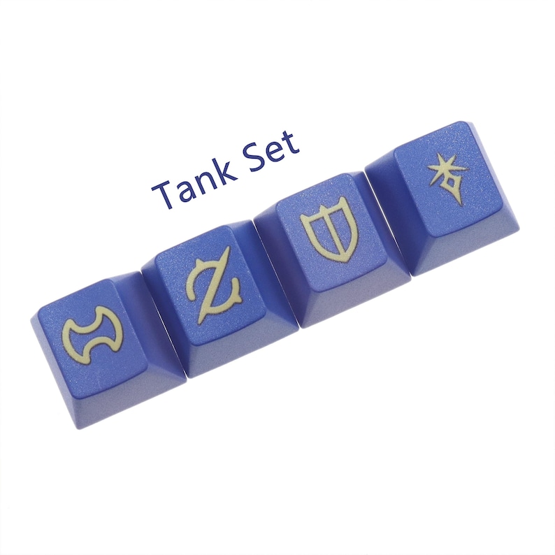 Puede incluir: Un conjunto de cuatro teclas azules con s&iacute;mbolos dorados. Los s&iacute;mbolos son un escudo, una estrella, una espada y una letra Z. Las teclas est&aacute;n etiquetadas como "Tank Set".