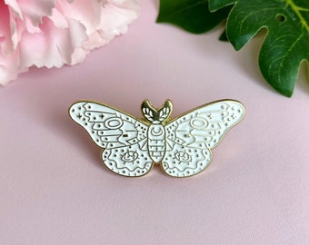 Pin's émaillé doré et blanc papillon céleste