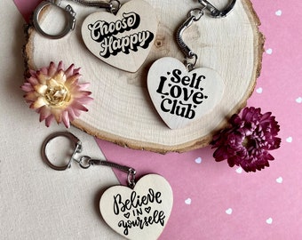 Heart-shaped wooden key ring with positive message