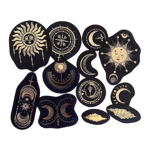 Set de 12 stickers noirs et dorés astres