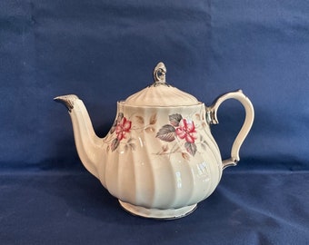 Vintage Sadler miniature swirl teapot with flowers and platinum colored trim (1940s).