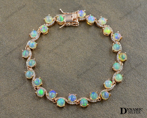 Jewelili Tennis Bracelet with Created Opal and Natural White Round Diamonds  in Sterling Silver