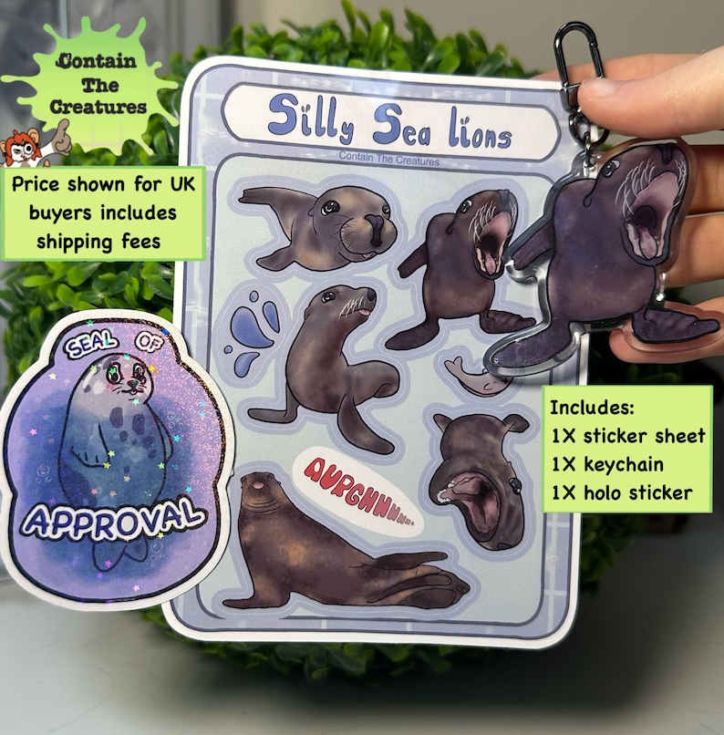 May include: A sticker sheet, keychain, and holo sticker set featuring cartoon sea lions. The sticker sheet has multiple sea lion illustrations. The keychain is a clear acrylic sea lion. The stickers and keychain are in shades of brown and blue.