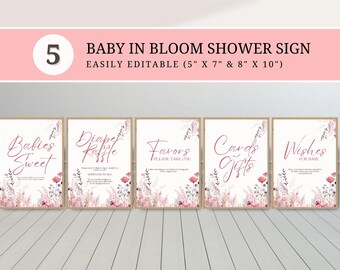 May include: A set of five baby shower signs with a floral design. The signs include text such as "Babies Sweet", "Diaper Raffle", "Favors", "Cards & Gifts", and "Wishes for Baby". The signs are in a pink and beige color scheme.