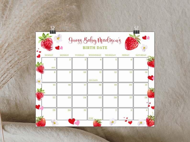 May include: A printable calendar with a strawberry theme for a baby shower. The calendar is titled "Guess Baby Madison's Birth Date" and has a strawberry graphic on the top. The calendar is for the month of May and June.