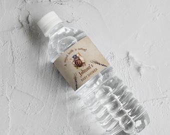 May include: A brown and white water bottle label with an owl illustration and the text "A magical bundle is coming! Johnson's Baby Shower".