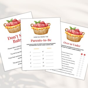 May include: Three printable baby shower game cards with a watercolor illustration of a basket of red apples. The games are "Don't Say Baby", "How Old Were the Parents-to-Be", and "Over or Under".
