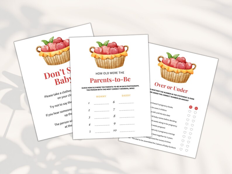 May include: Three printable baby shower game cards with a watercolor illustration of a basket of red apples. The games are "Don't Say Baby", "How Old Were the Parents-to-Be", and "Over or Under".