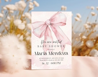 May include: A pink baby shower invitation featuring a watercolour illustration of a pink bow. The text reads "You are invited to a Baby Shower in honour of Maria Mendoza. 123 Anywhere St., Any City, ST 12345. Please RSVP to Sarah at +123-456-7899. 14.12 6:00 PM"