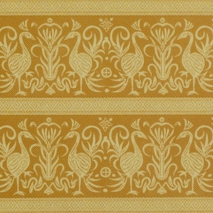 May include: A repeating pattern of stylized birds and floral motifs in a yellow and cream color scheme. The pattern is woven into the fabric, creating a textured effect.