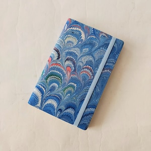Turquoise 100% recycled soft cover journal, hand marbled withbookmark and elastic band