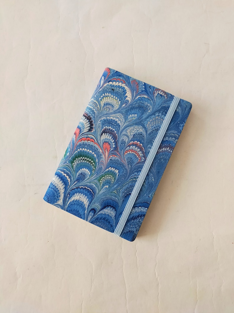 Turquoise 100% recycled soft cover journal, hand marbled withbookmark and elastic band