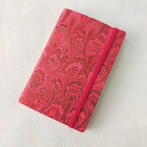 Red 100% recycled soft cover journal, hand marbled withbookmark and elastic band