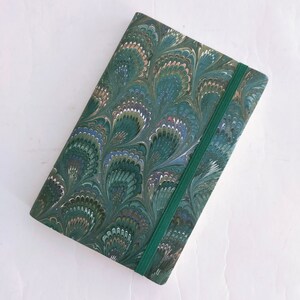 Green and red 100% recycled soft cover journal, hand marbled withbookmark and elastic band